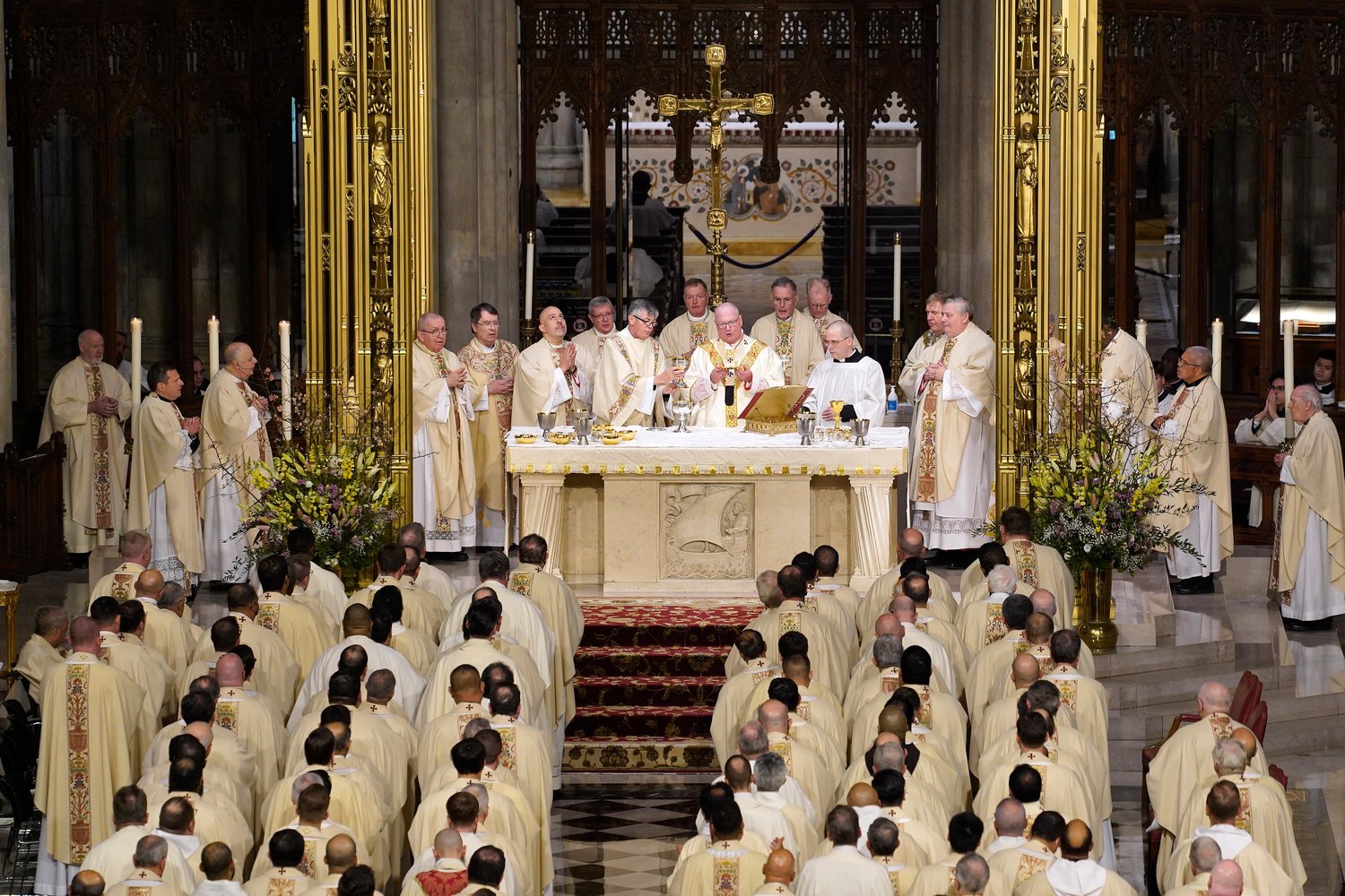 Cardinal Dolan and other clergy gather in the sanctuary during the episcopal ordination of Auxiliary Bishops John S. Bonnici and Joseph A. Espaillat March 1 at St. Patrick's Cathedral.
